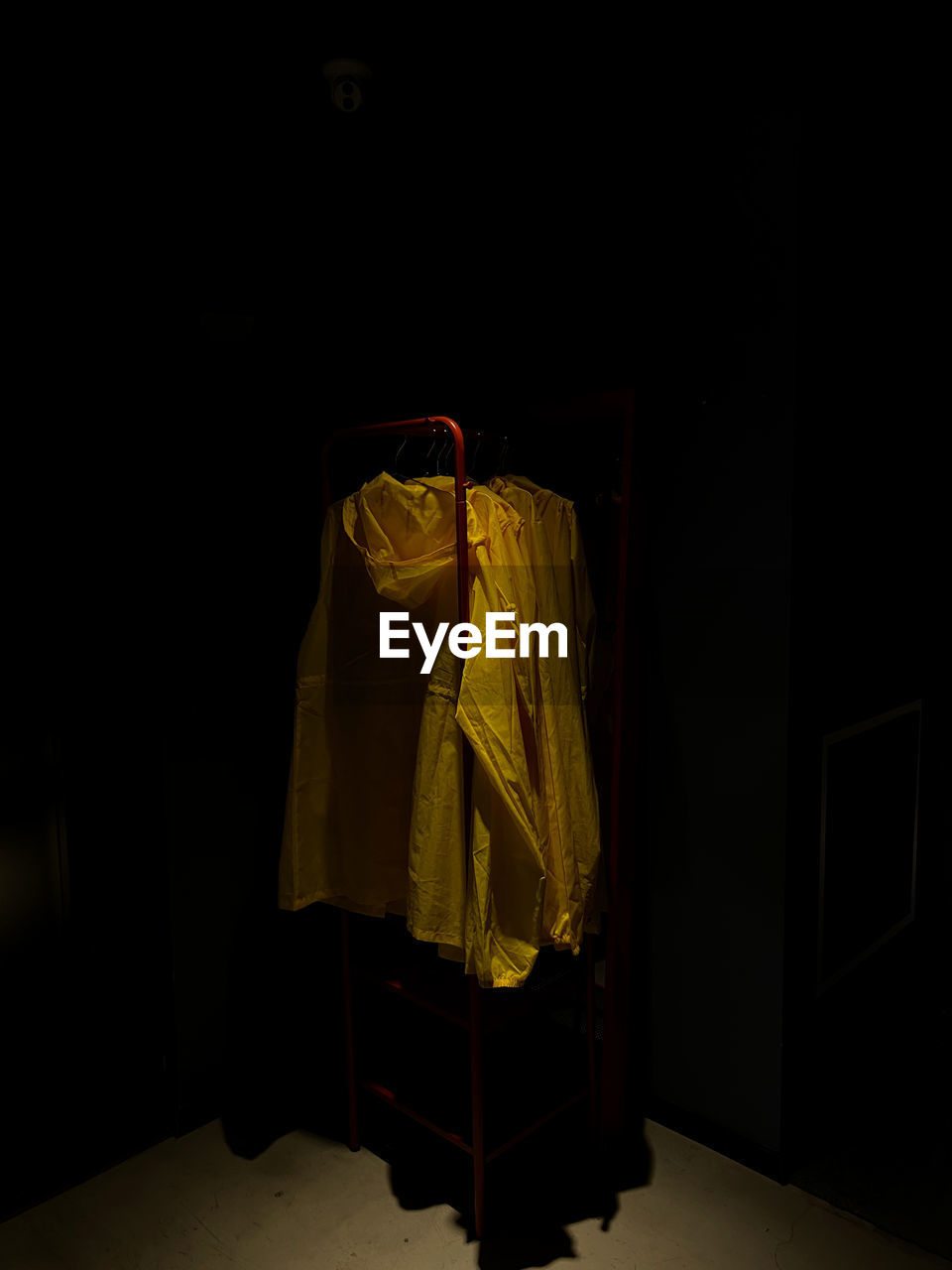 Close-up of clothes hanging against black background