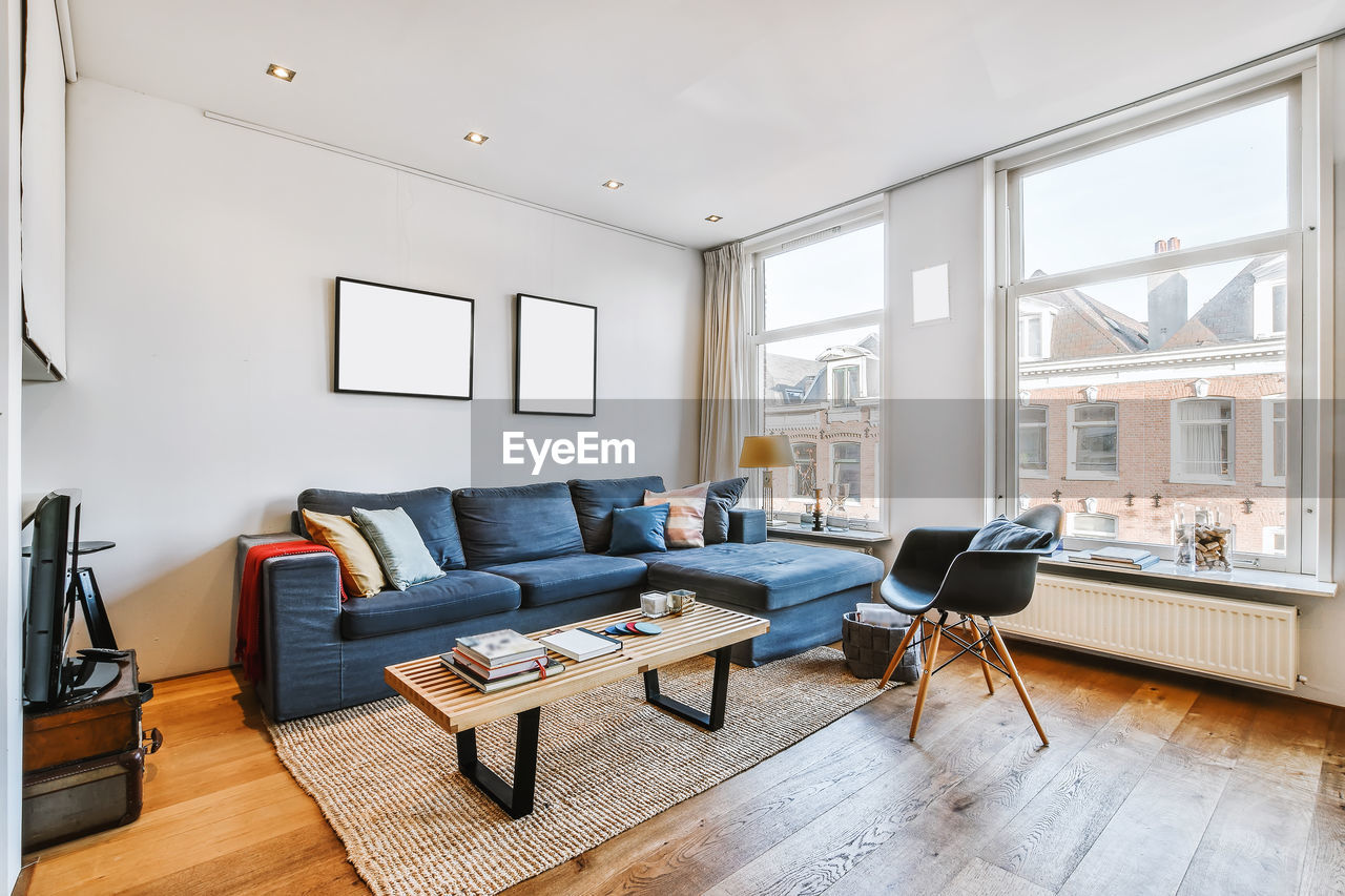 Empty chairs and tables on hardwood floor at home