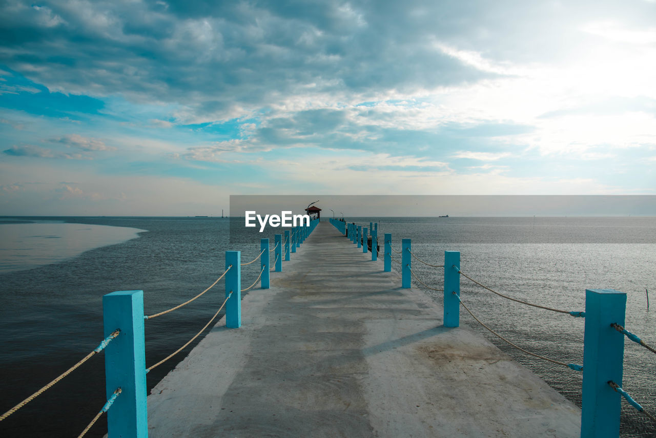 Pier over sea against sky