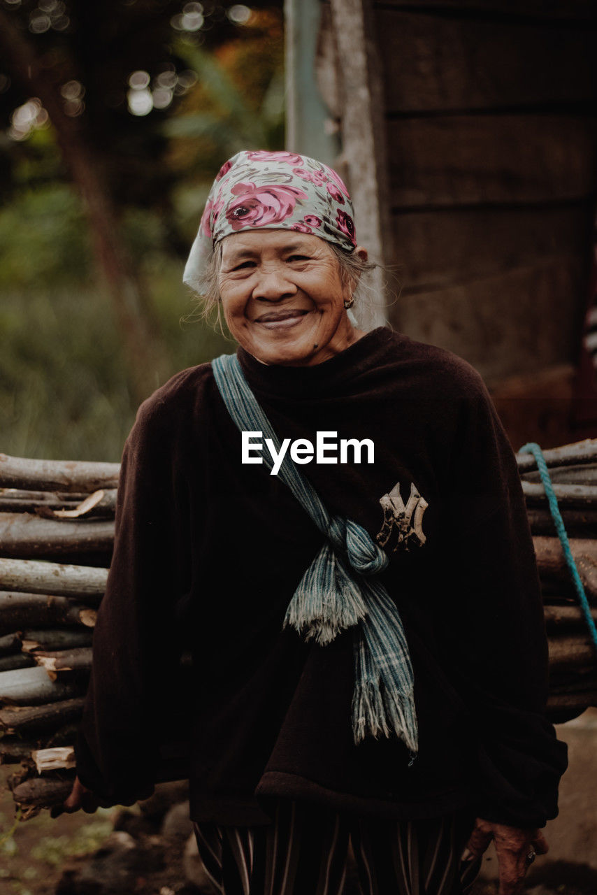 Portrait of old woman outdoors