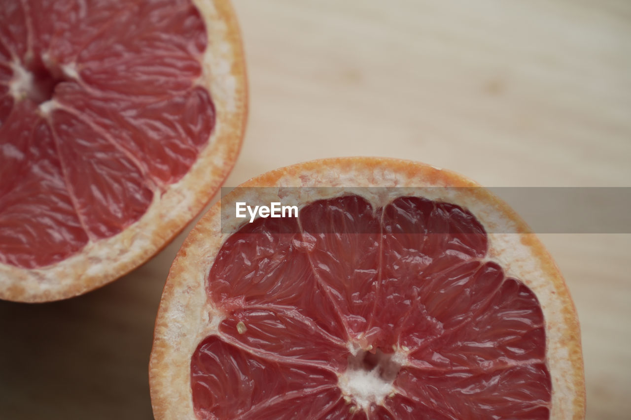 food and drink, food, healthy eating, fruit, wellbeing, grapefruit, blood orange, slice, freshness, cross section, citrus, plant, citrus fruit, produce, no people, indoors, close-up, juicy, vitamin, halved, organic, antioxidant, studio shot, orange color, ripe, orange, still life, group of objects, red, circle, table