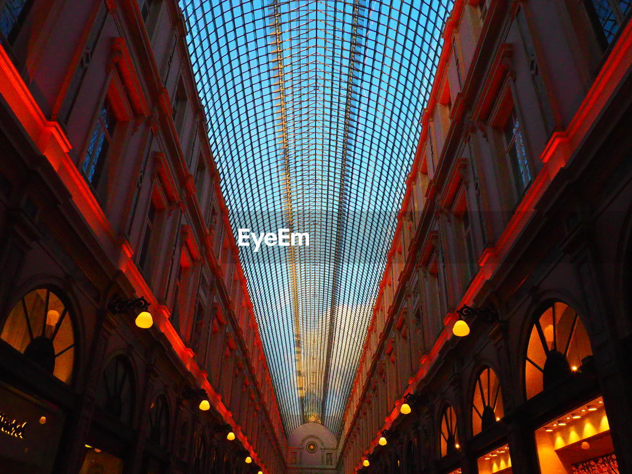 LOW ANGLE VIEW OF ILLUMINATED BUILDINGS IN CITY