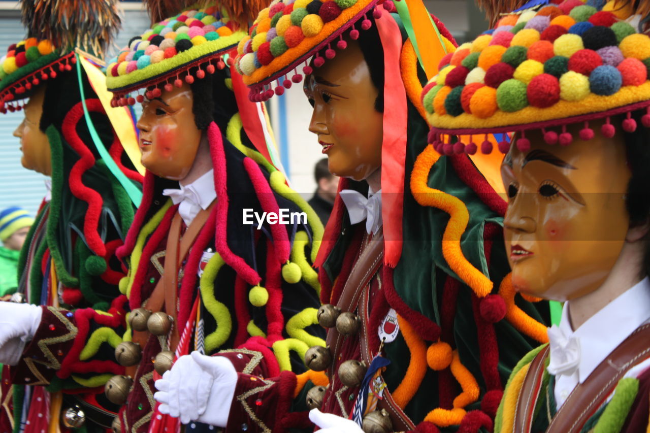 Close-up of people wearing masks