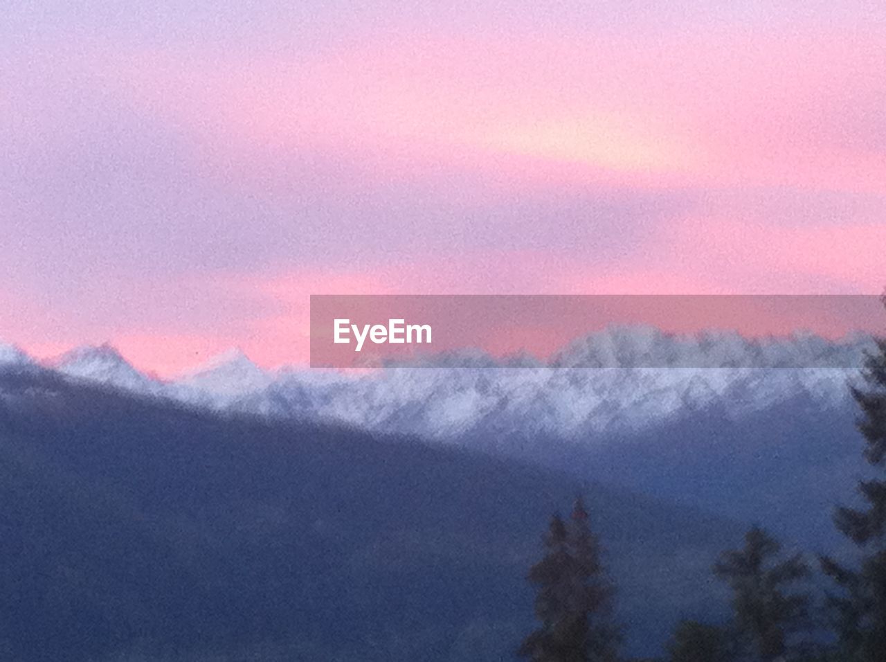 SCENIC VIEW OF MOUNTAINS DURING WINTER AGAINST SKY