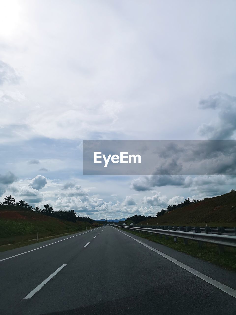 EMPTY ROAD AGAINST SKY