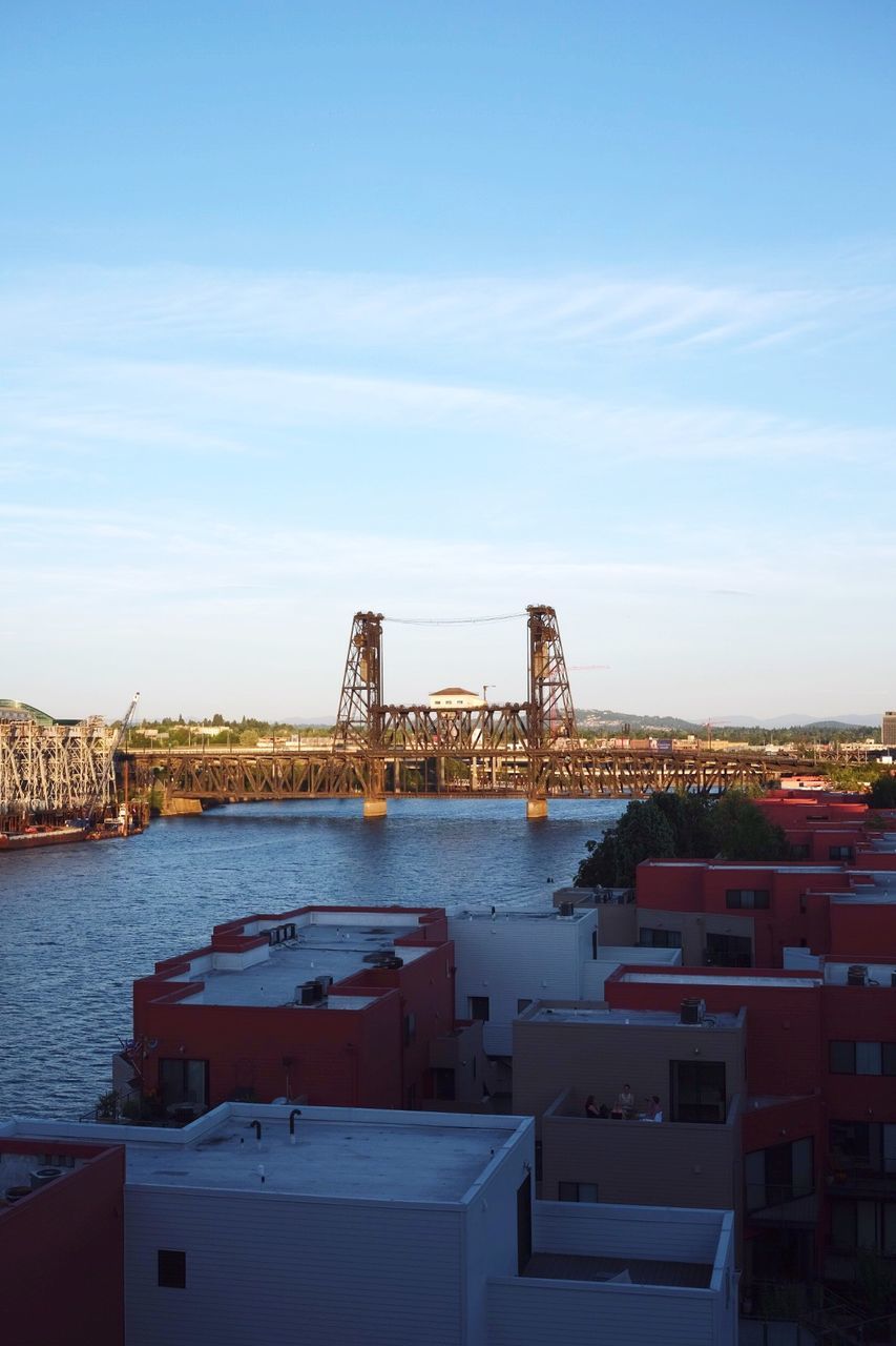 Steel bridge over willamette river against sky