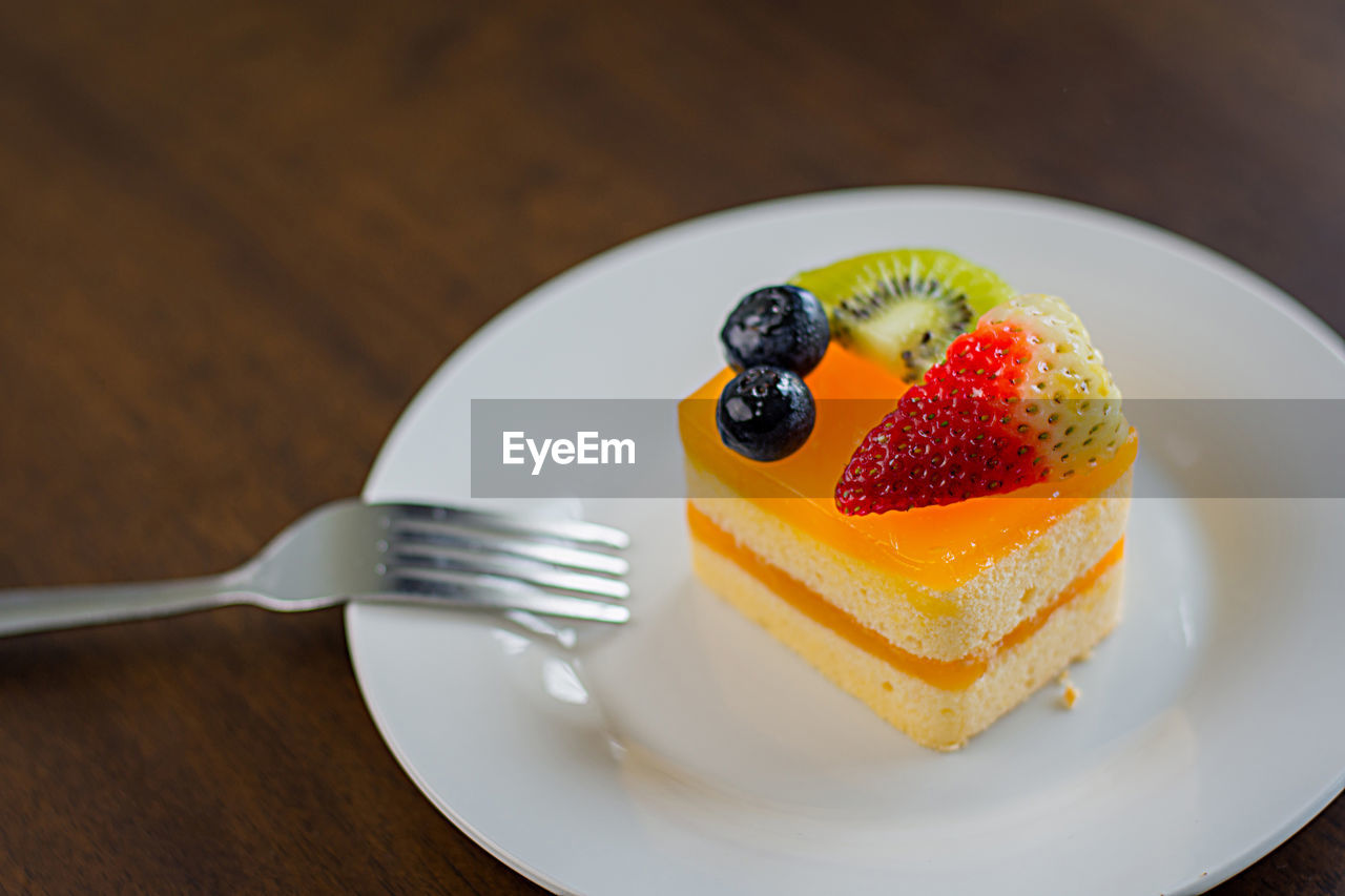 Close-up of cake in plate on table