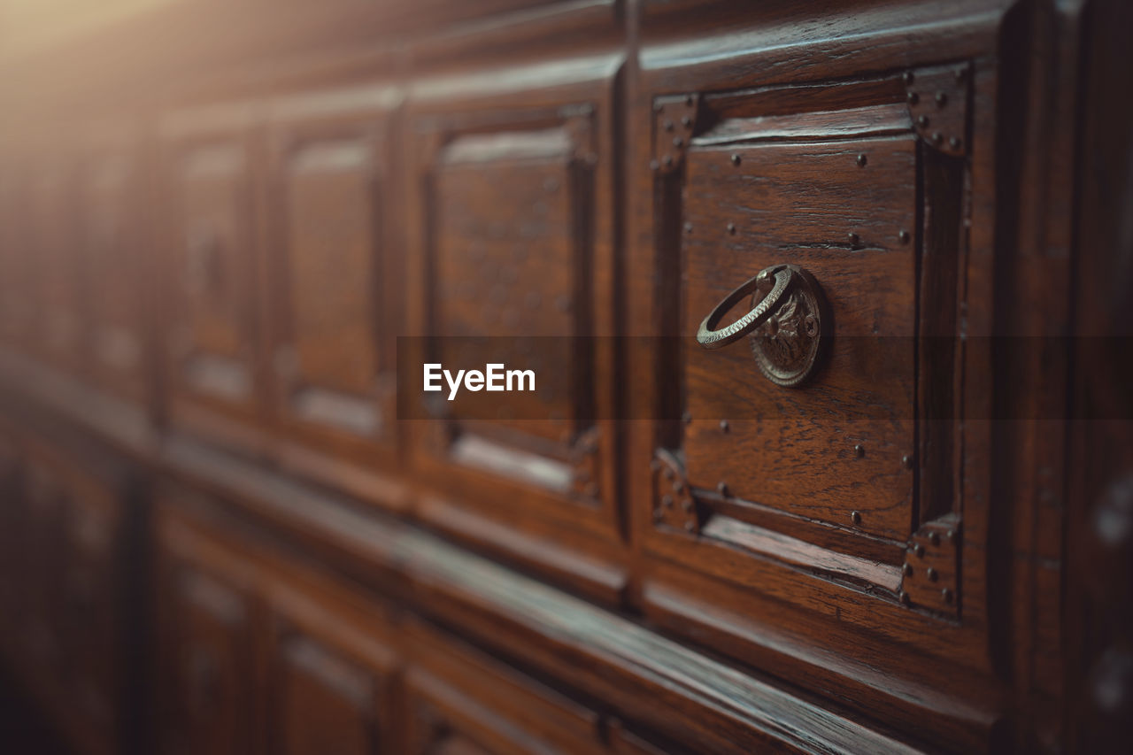 wood, cabinetry, furniture, no people, chest of drawers, architecture, drawer, room, indoors, door, selective focus, brown, retro styled, sideboard, old, entrance, close-up, protection