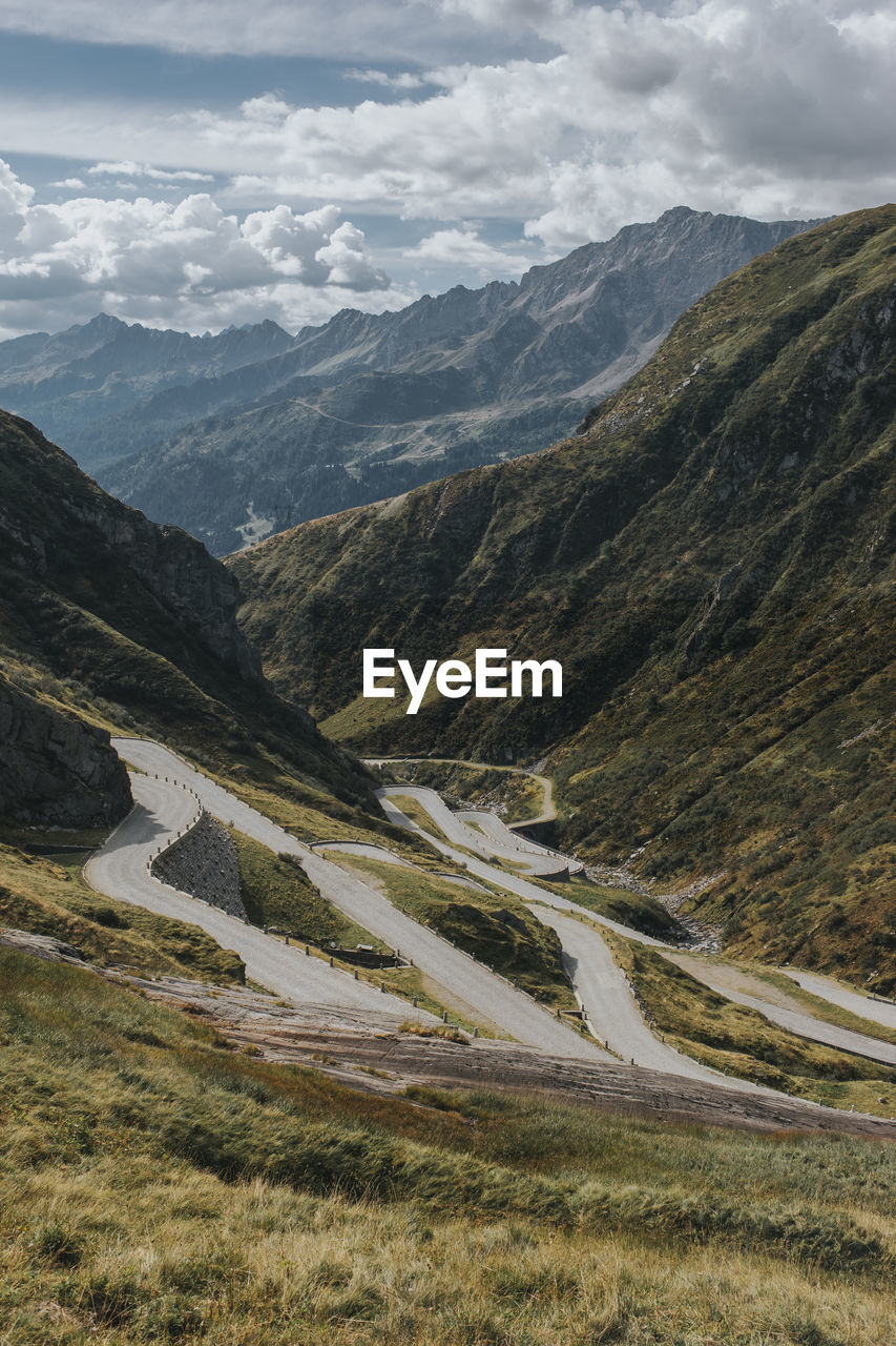 Winding roads at gotthard pass on sunny day