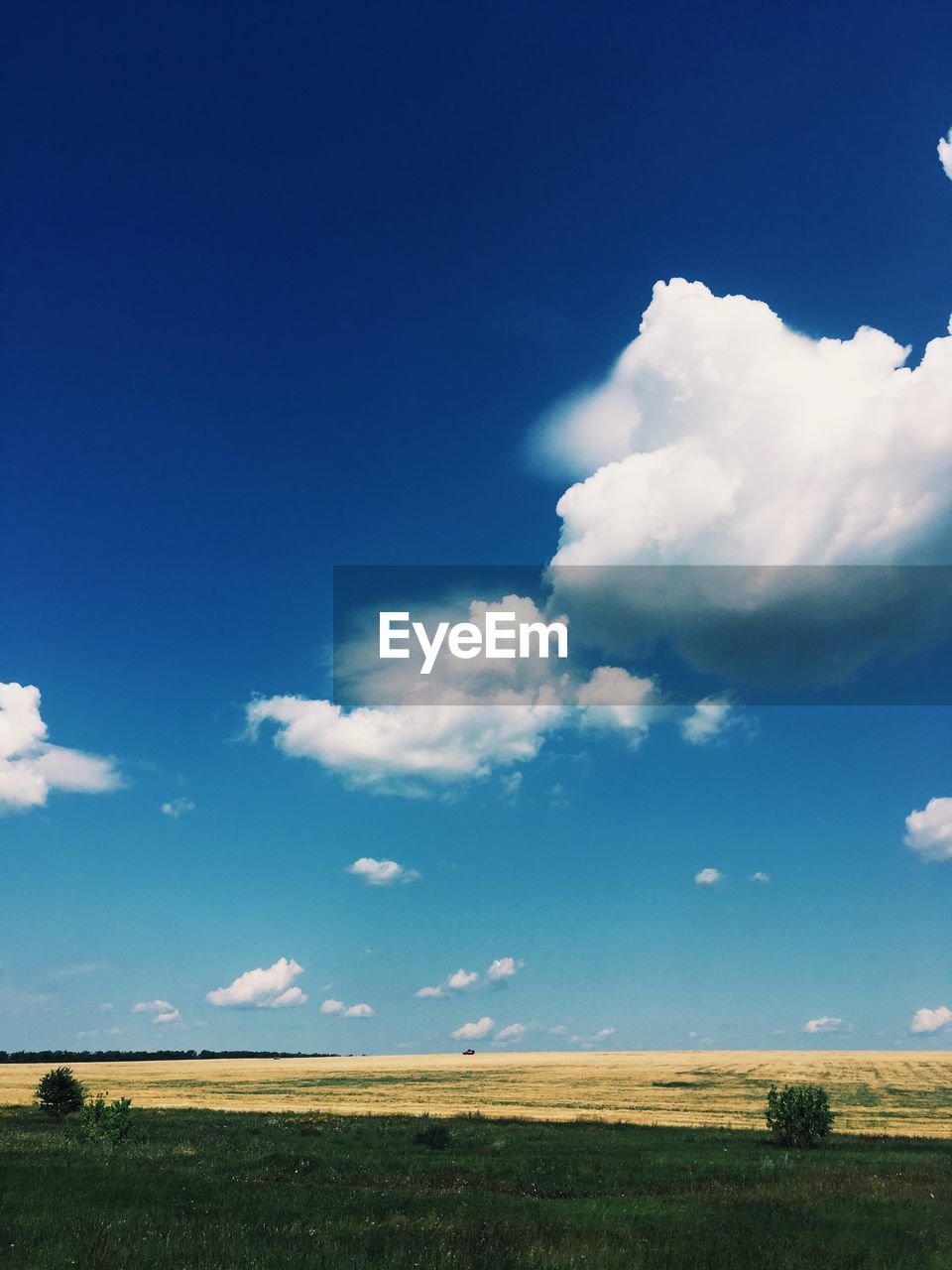 SCENIC VIEW OF LAND AGAINST BLUE SKY