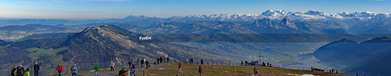 Panoramic view of mountains against blue sky