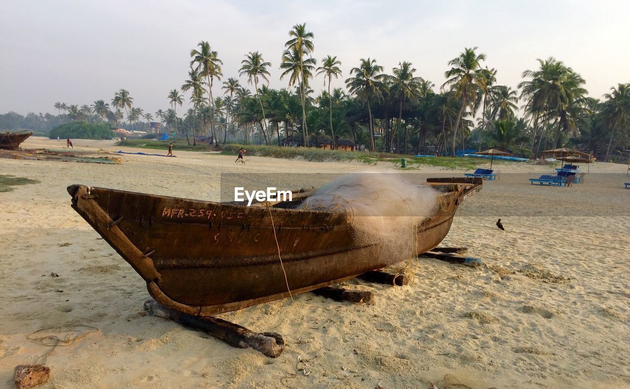 Fishing net in boat moored at beach