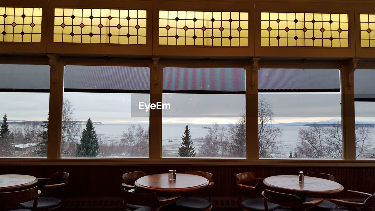 Interior of restaurant against sea