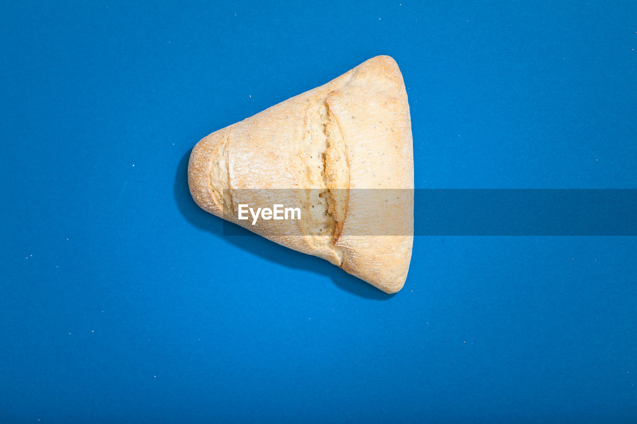 High angle view of bread against blue background