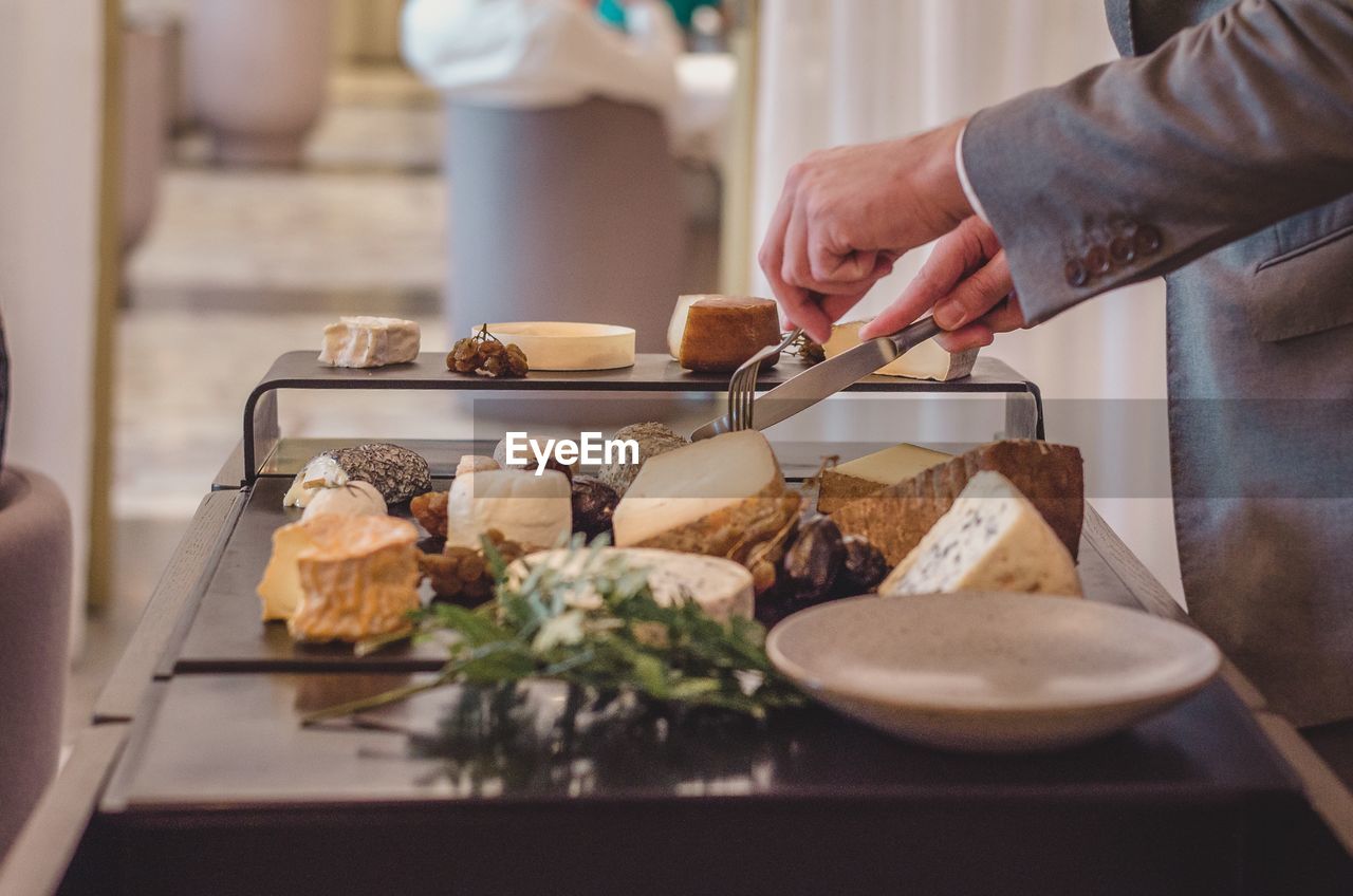 Midsection of person preparing food on table