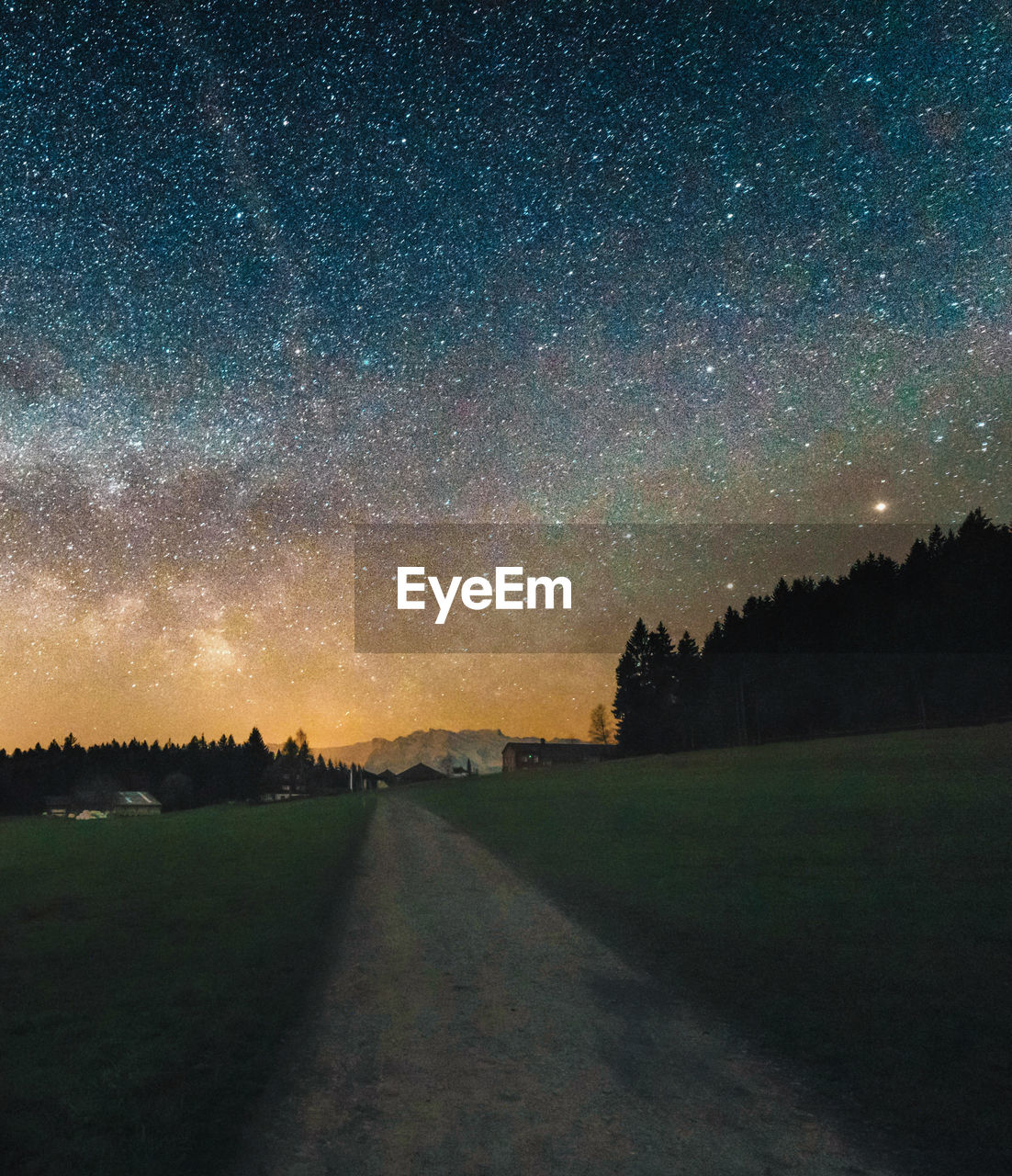 Scenic view of field against sky at night