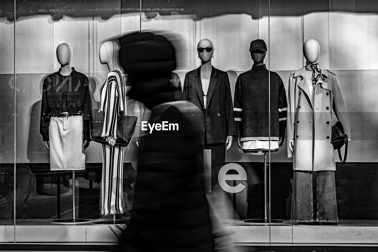 black, black and white, monochrome, monochrome photography, white, indoors, men, adult, business, clothing, human representation, display window, mannequin, business finance and industry, store