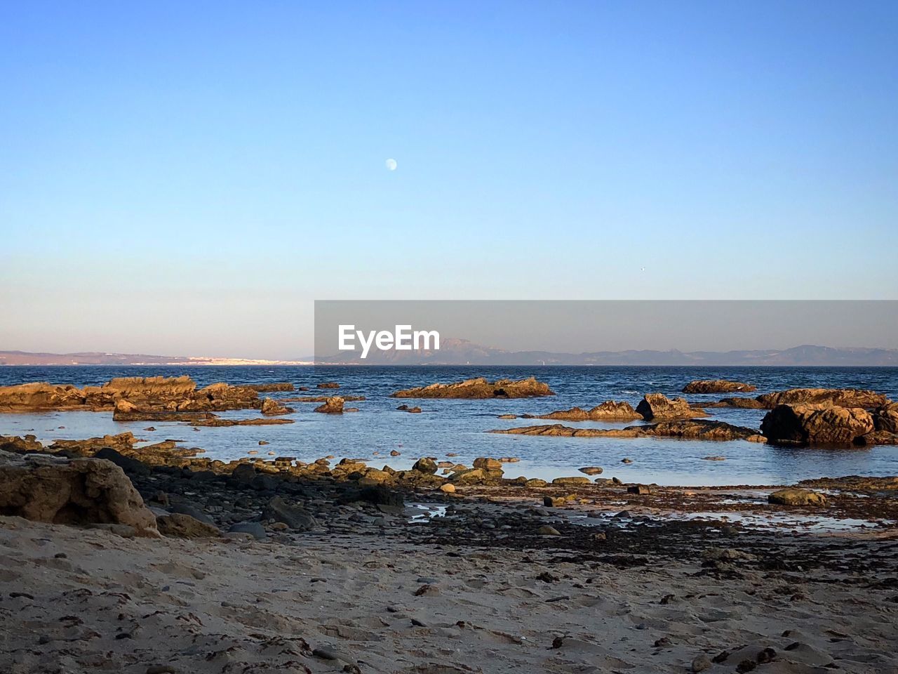 Scenic view of sea against clear sky