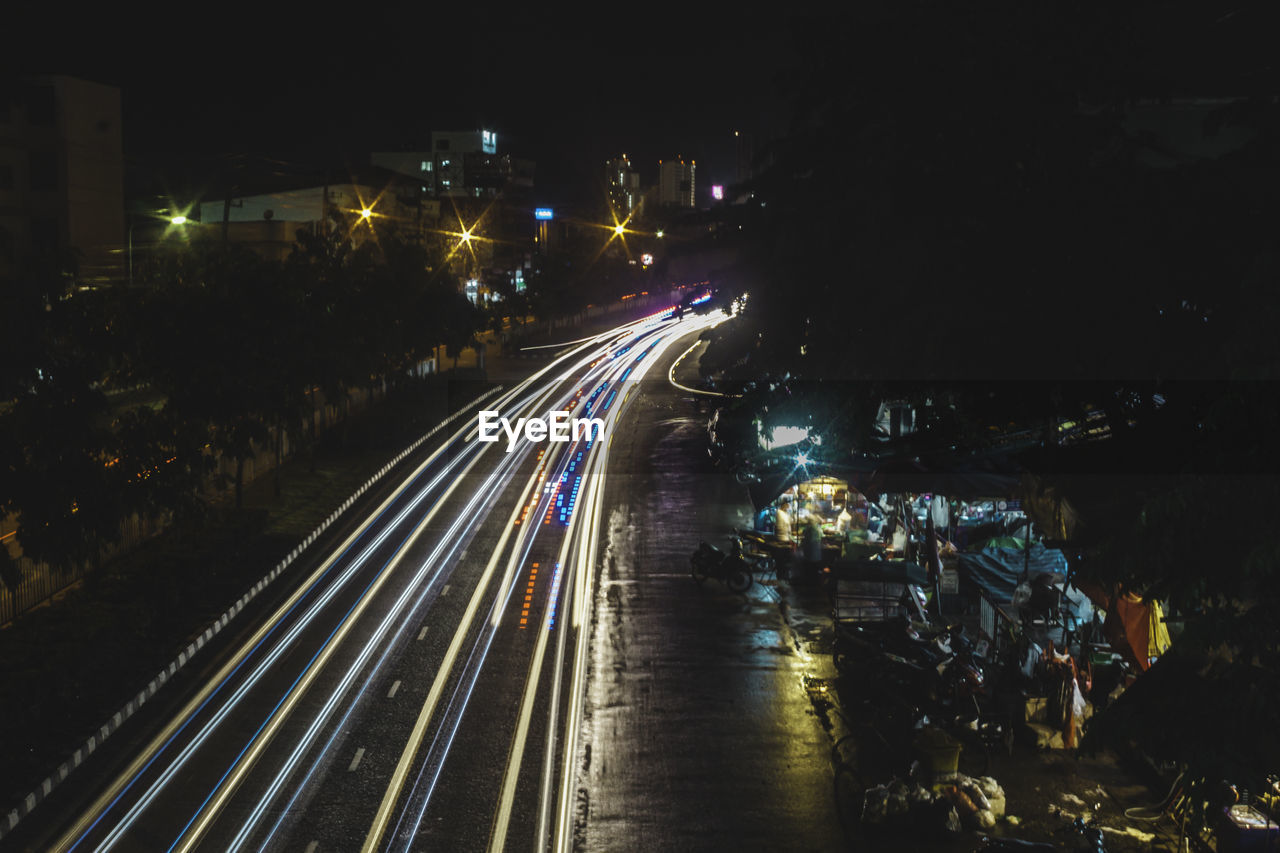 High angle view of light trails on road at night