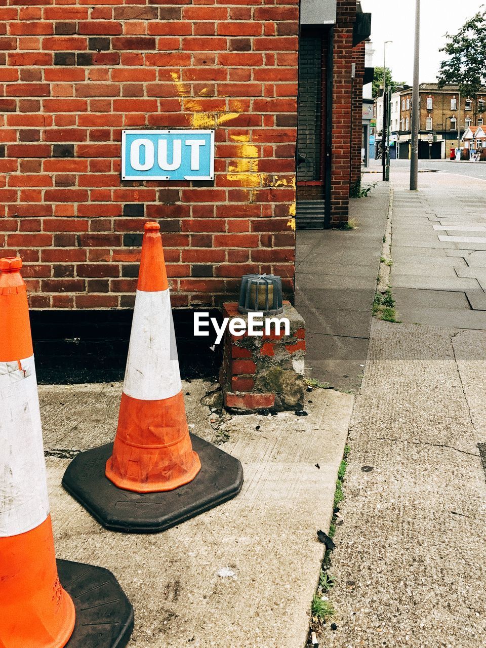 ROAD SIGN ON ORANGE WALL