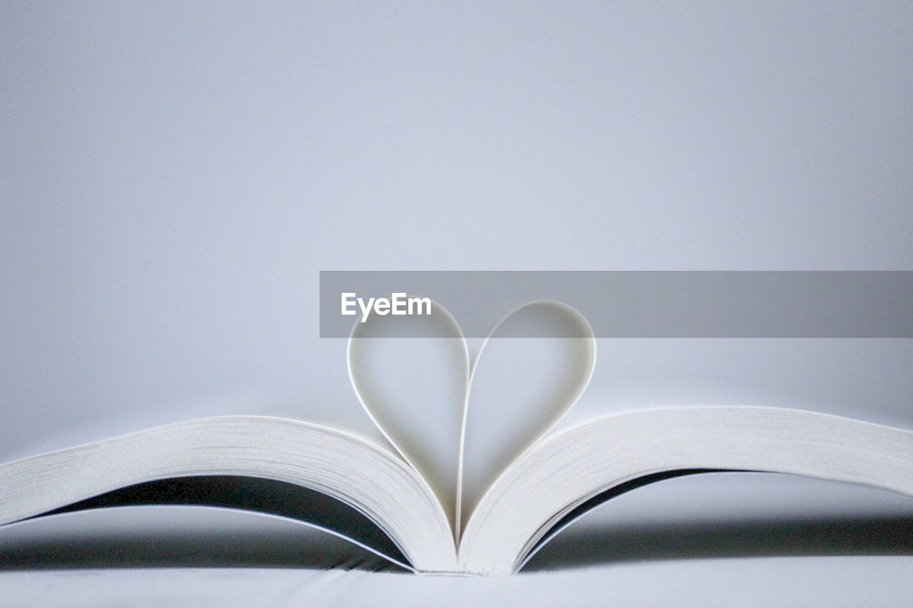 Close-up of open book against white background