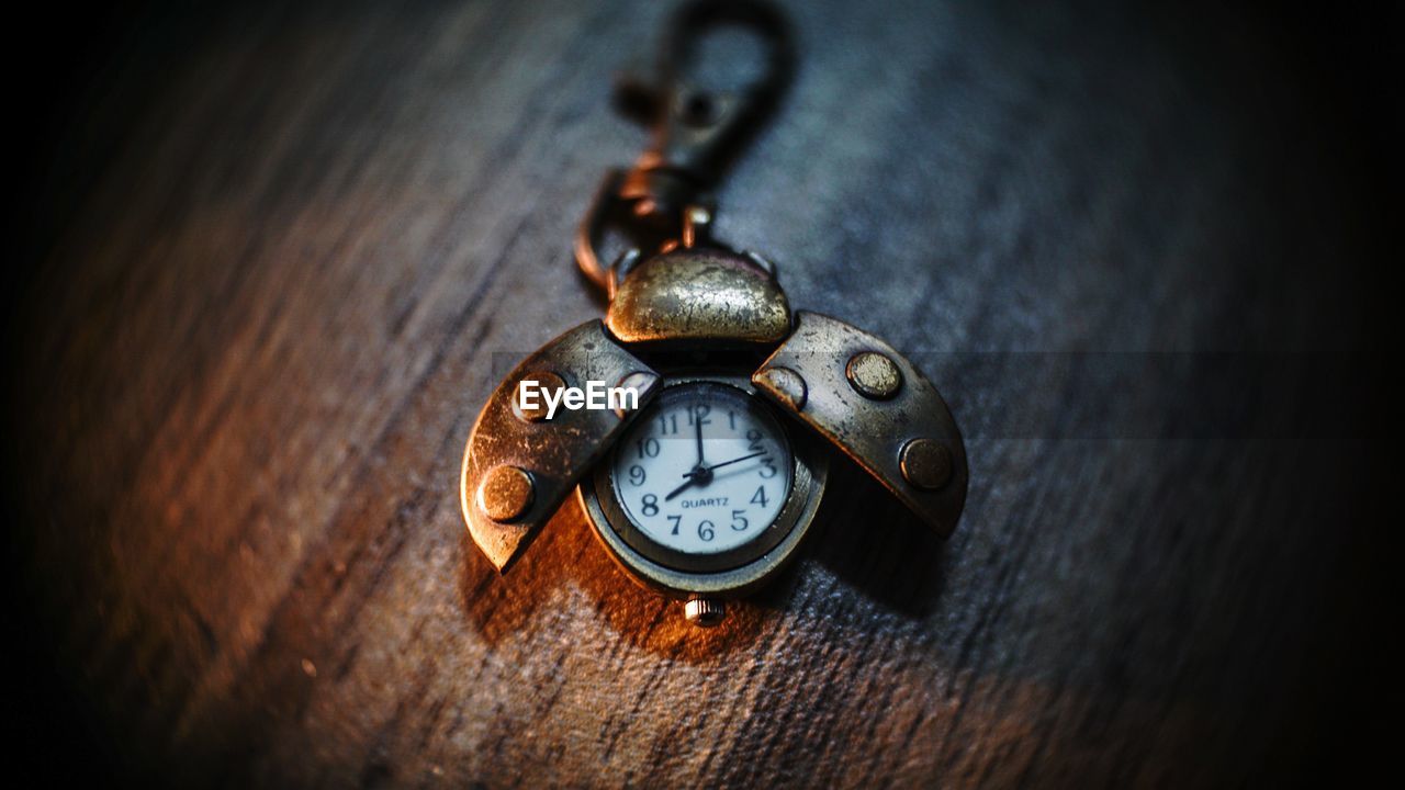 CLOSE-UP OF CLOCK ON METAL