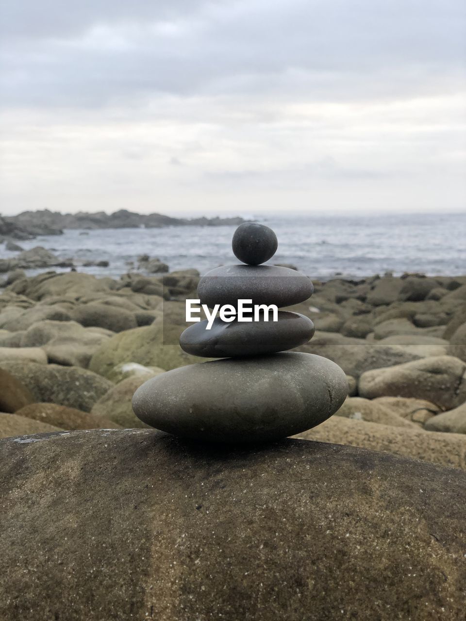 STACK OF PEBBLES ON BEACH