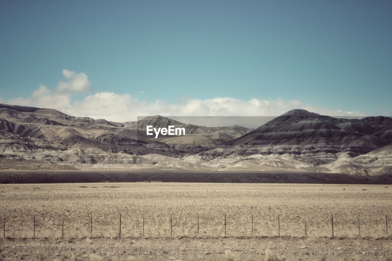 Scenic view of landscape and mountains against sky