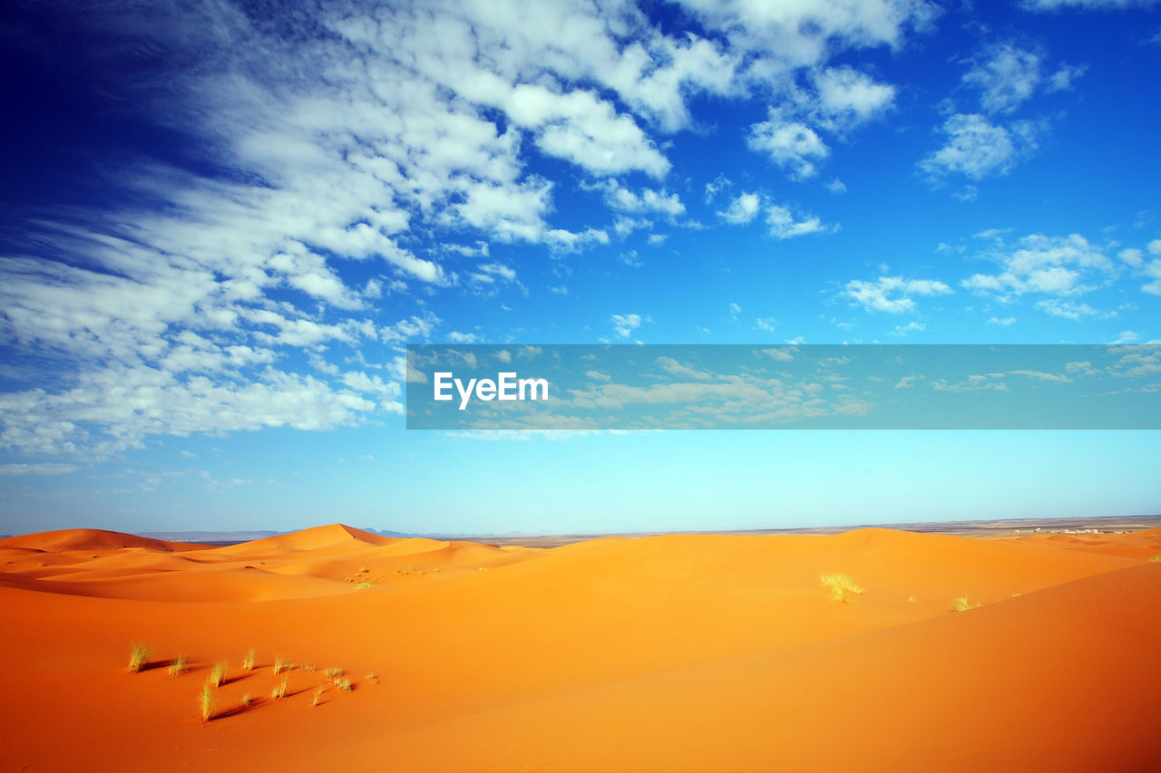 Sand dune against sky