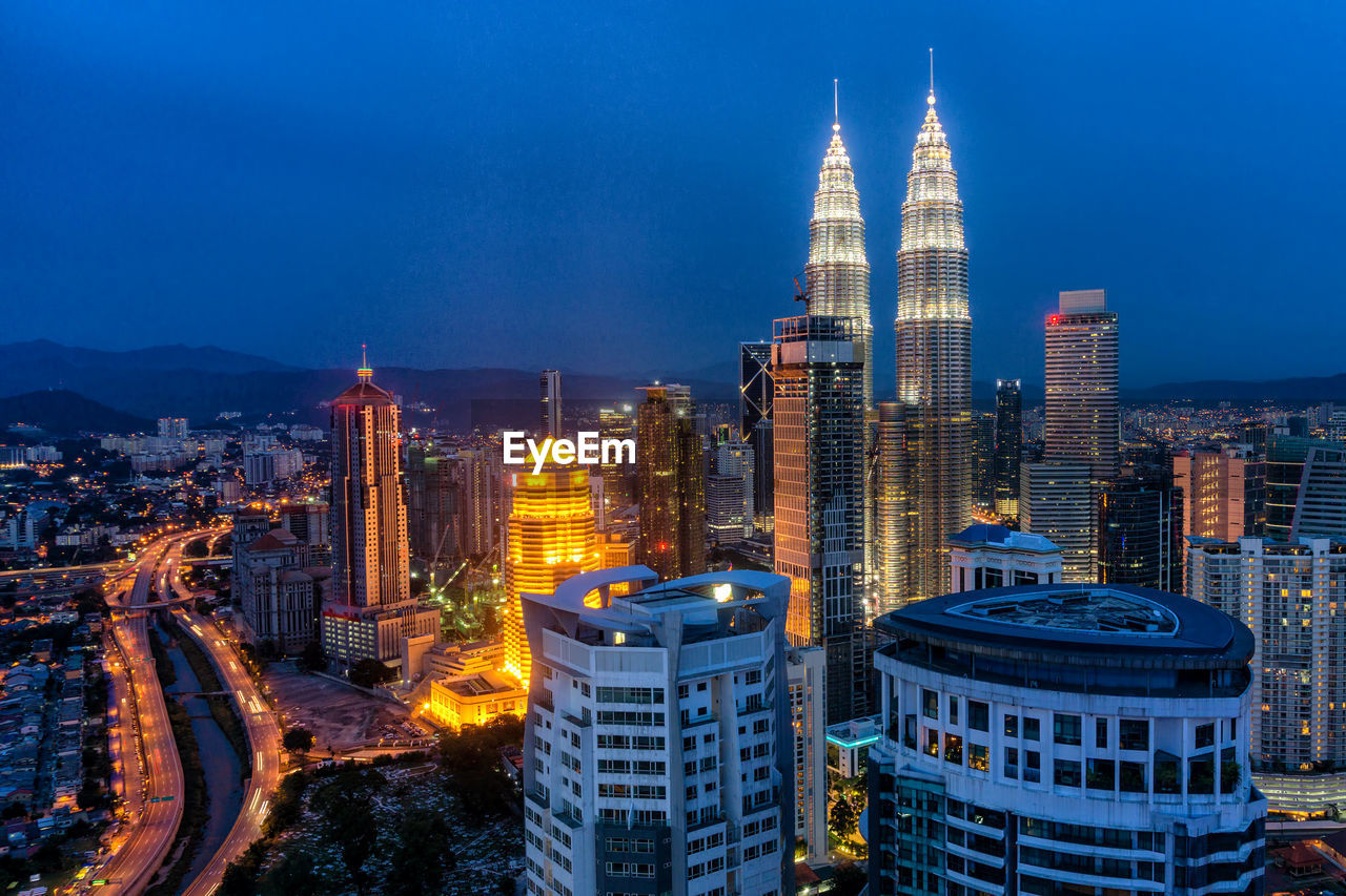 Aerial view of city lit up at night