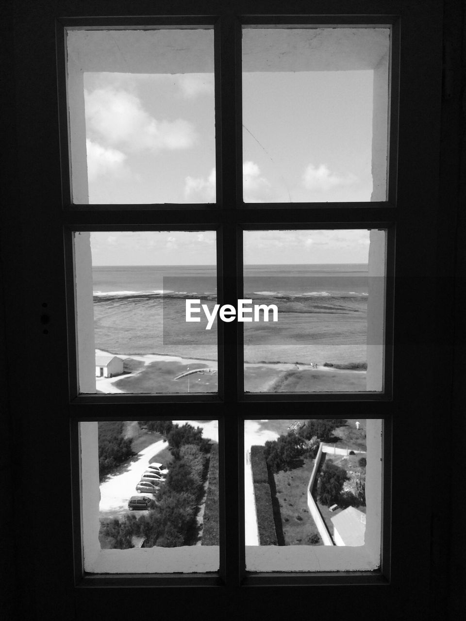 Sea coast seen through window