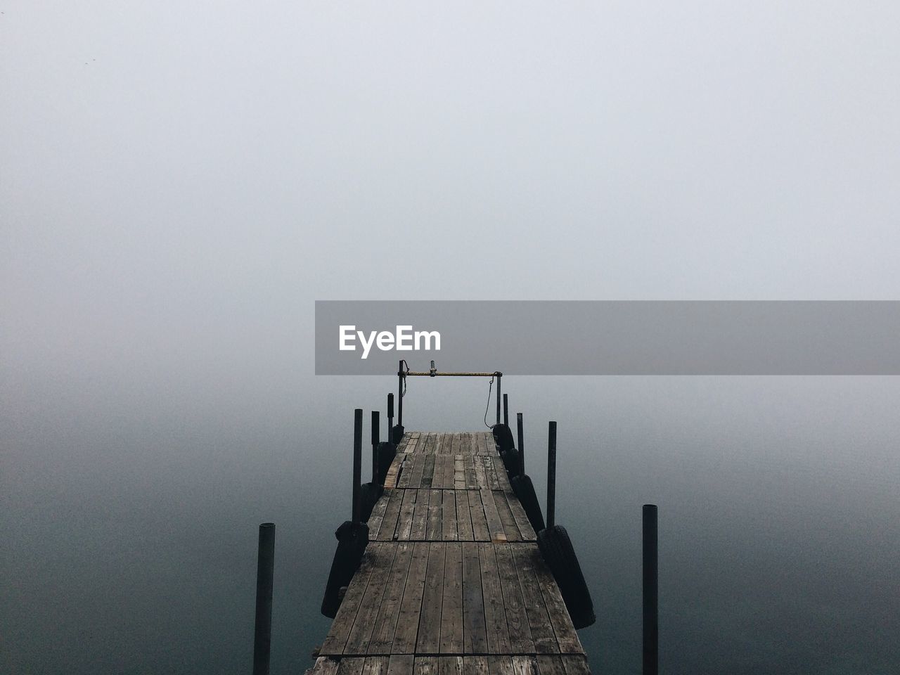 Wooden jetty on calm lake