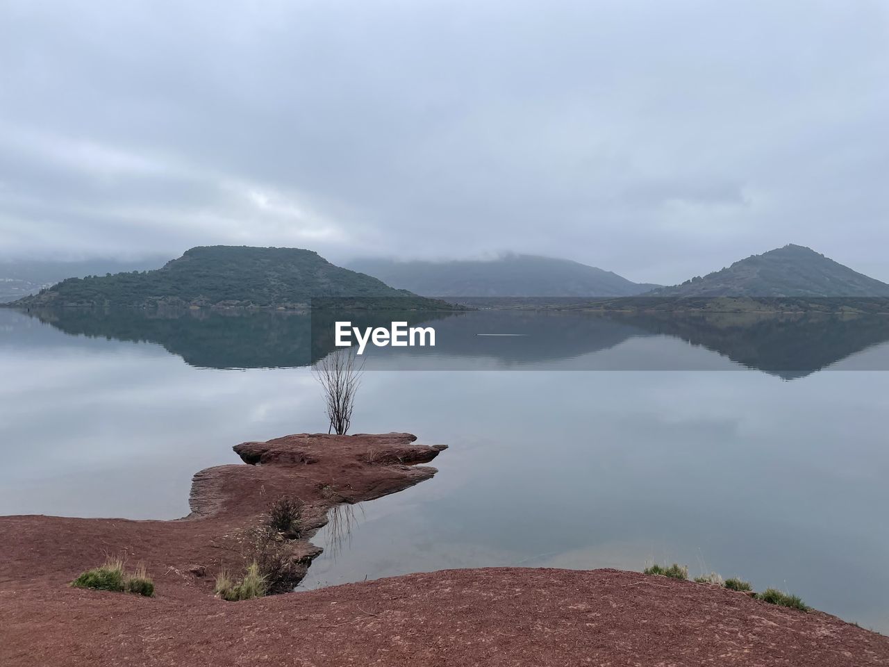 Misty day in winter at lake salagou in france