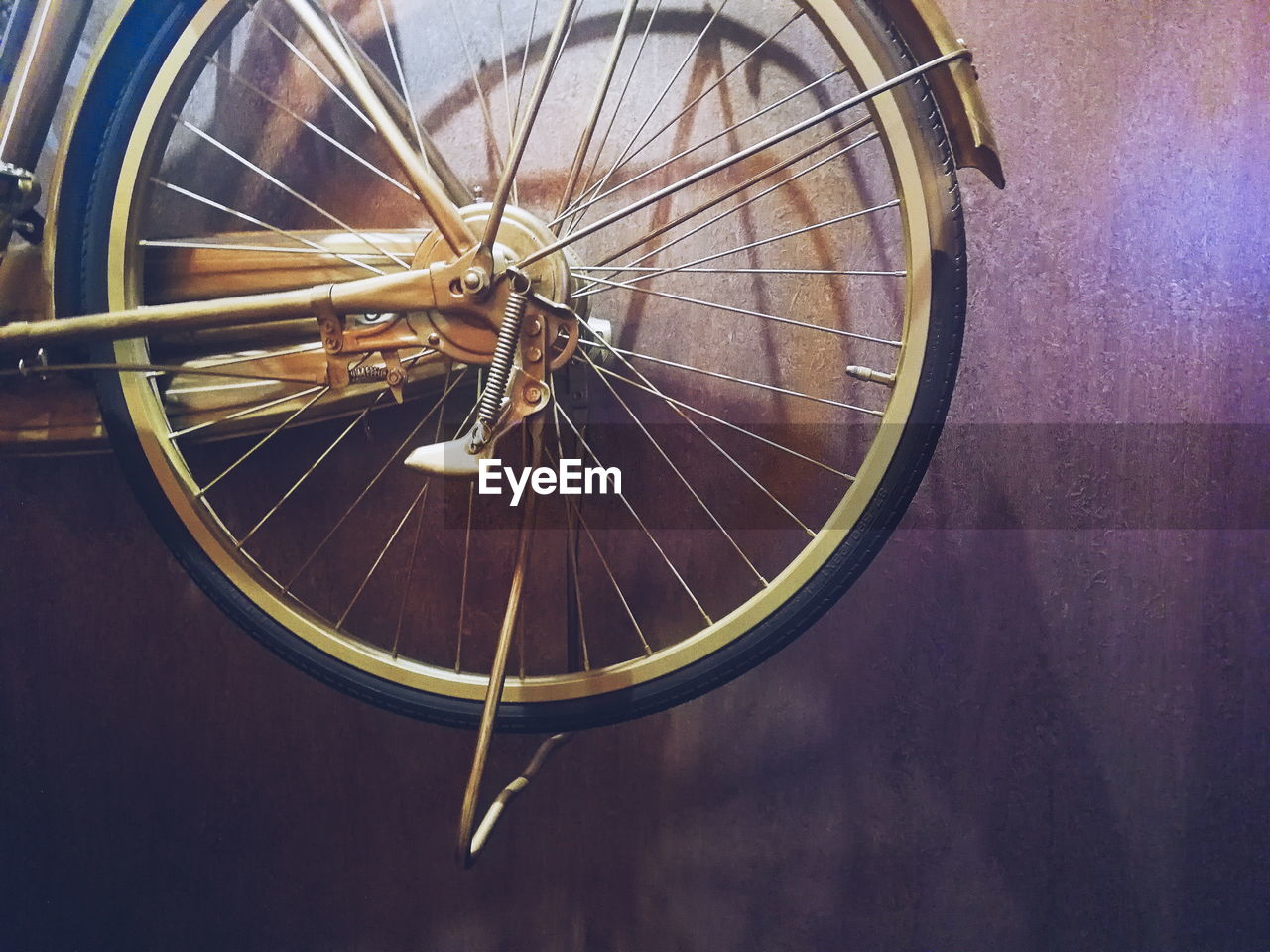 Cropped image of bicycle against wall