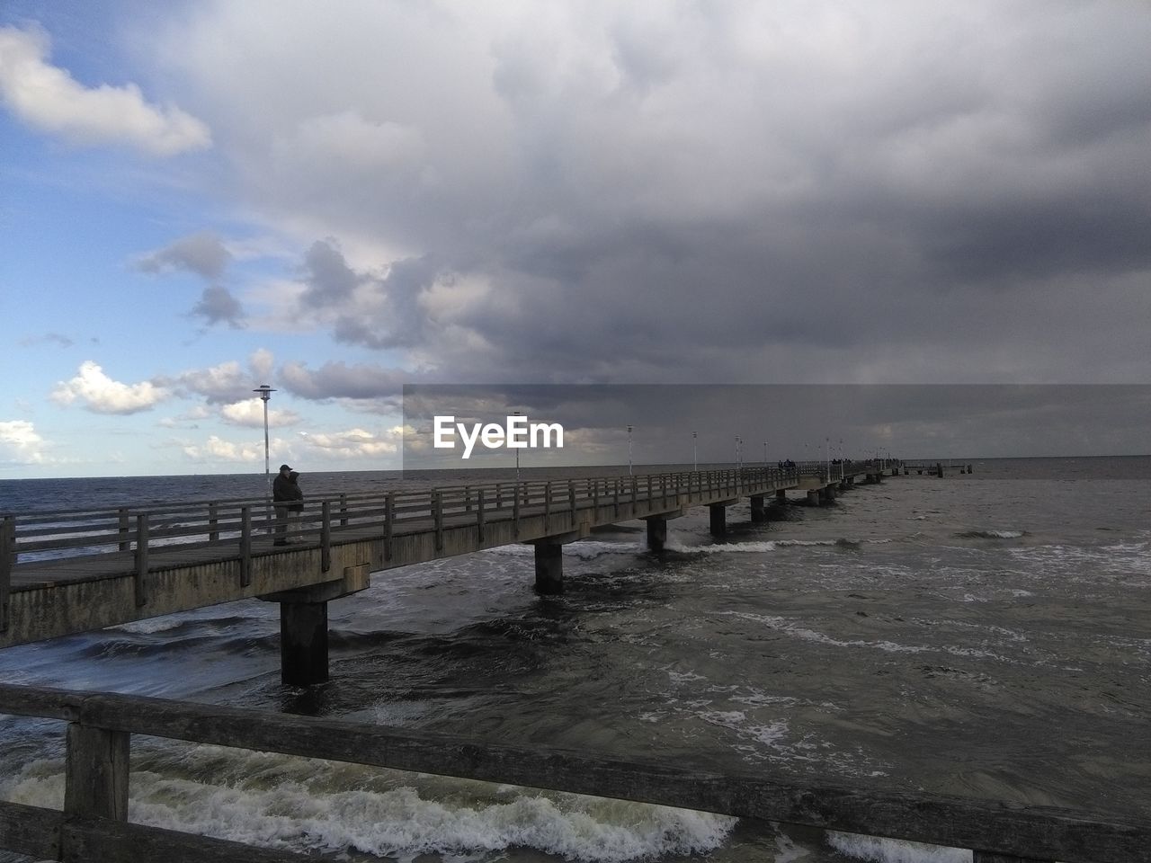 Pier over sea against sky