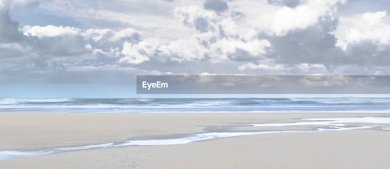 Scenic view of beach against sky