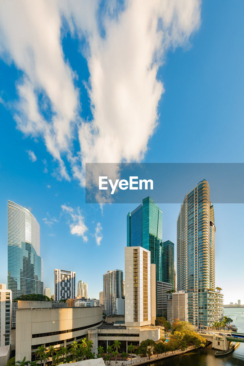 architecture, city, built structure, building exterior, sky, office building exterior, building, skyscraper, skyline, landscape, urban skyline, cityscape, urban area, cloud, horizon, downtown district, office, residential district, nature, metropolitan area, tower block, water, travel destinations, landmark, downtown, business, city life, blue, travel, no people, outdoors, metropolis, reflection, development, business finance and industry, transportation, financial district, day, waterfront, river, tower, sunlight