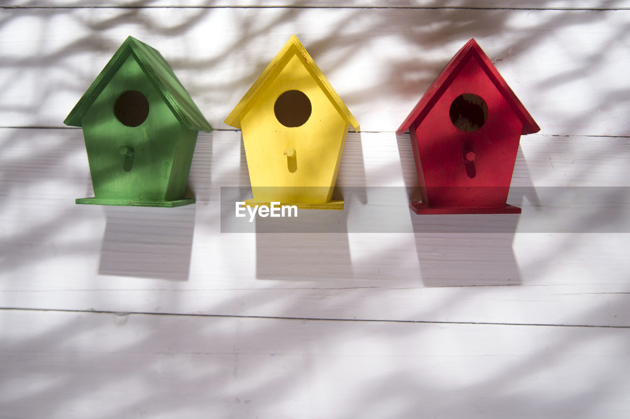 Close-up of multi colored model house on table