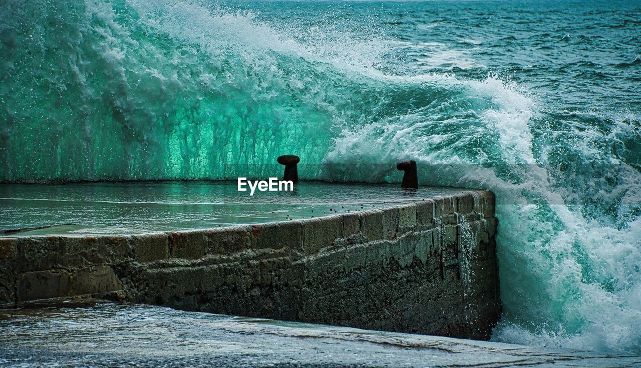 water, sea, wave, ocean, wind wave, beauty in nature, motion, nature, scenics - nature, men, day, sports, water sports, beach, outdoors, surfing, land, coast, two people, leisure activity, lifestyles, terrain