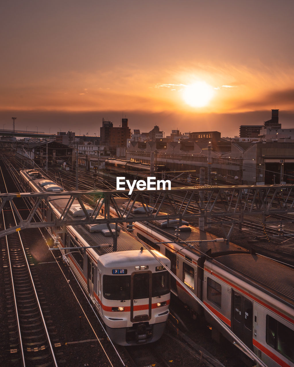 HIGH ANGLE VIEW OF TRAIN AT SUNSET