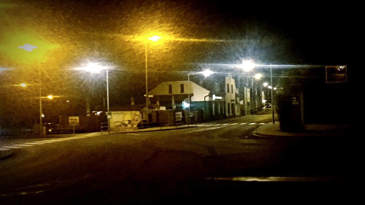 VIEW OF ILLUMINATED STREET LIGHT AT NIGHT