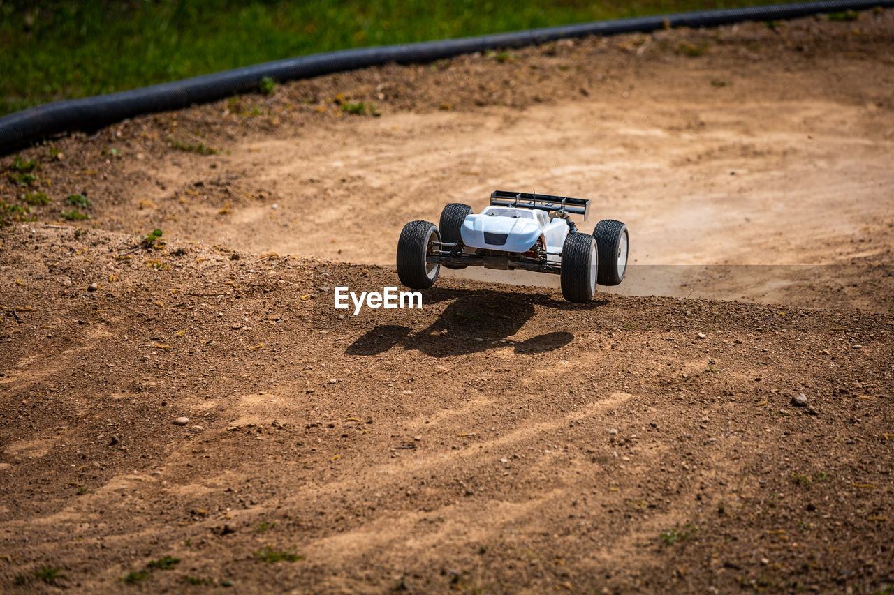 Rc car driving on an offroad outdoor track
