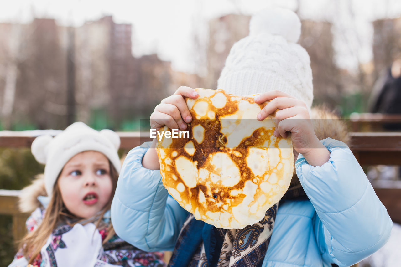 PORTRAIT OF GIRL HOLDING ICE CREAM CONE