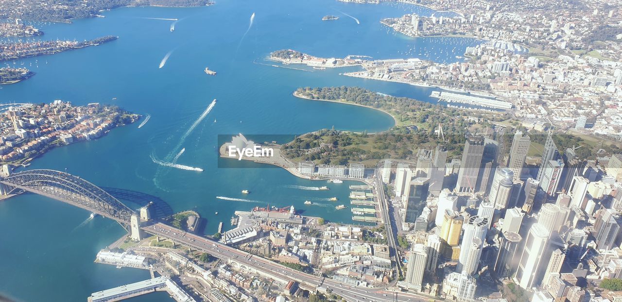 HIGH ANGLE VIEW OF CITY BY SEA