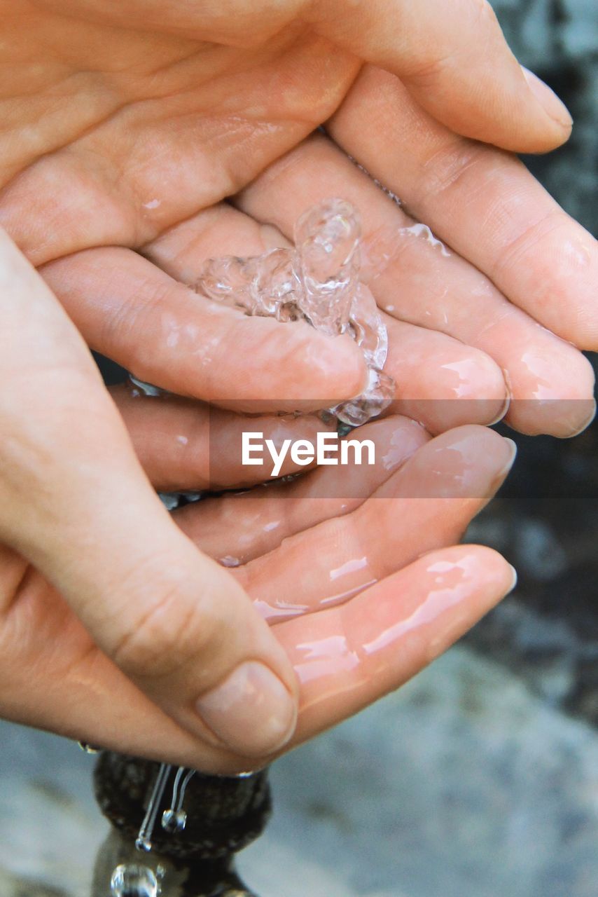 Close up of hands with water