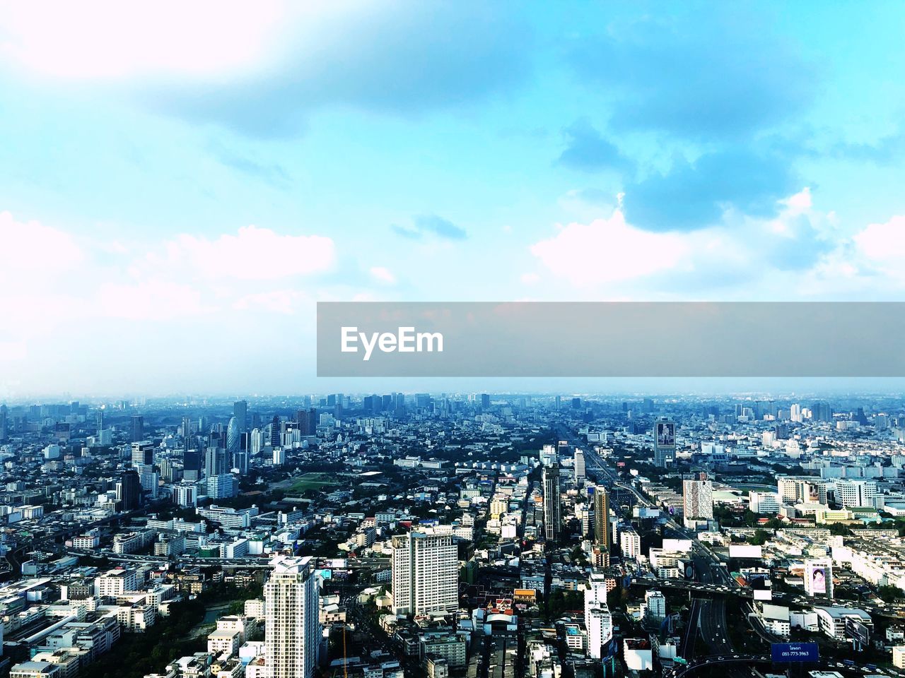 High angle view of buildings in city against sky