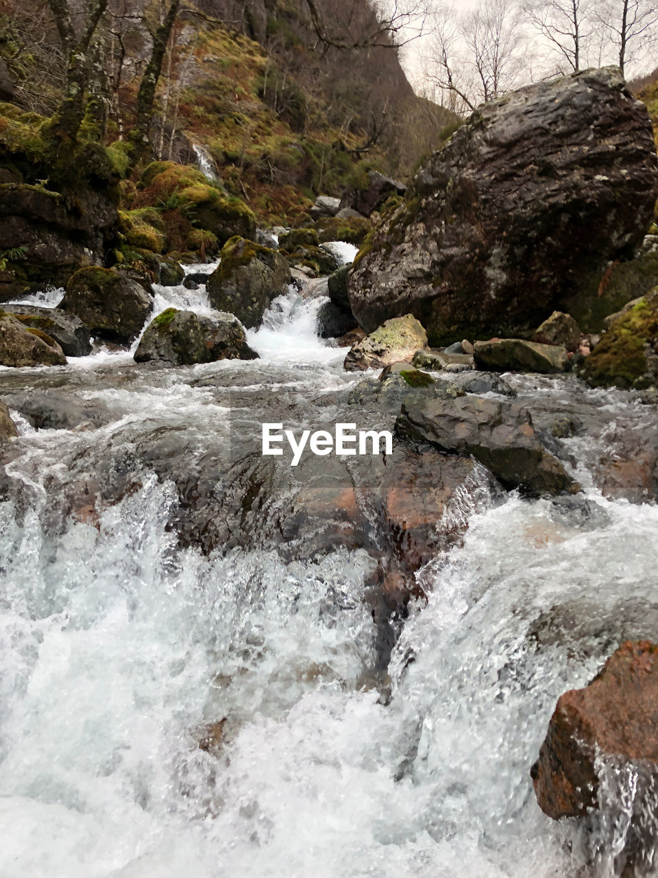 WATERFALL AMIDST ROCKS