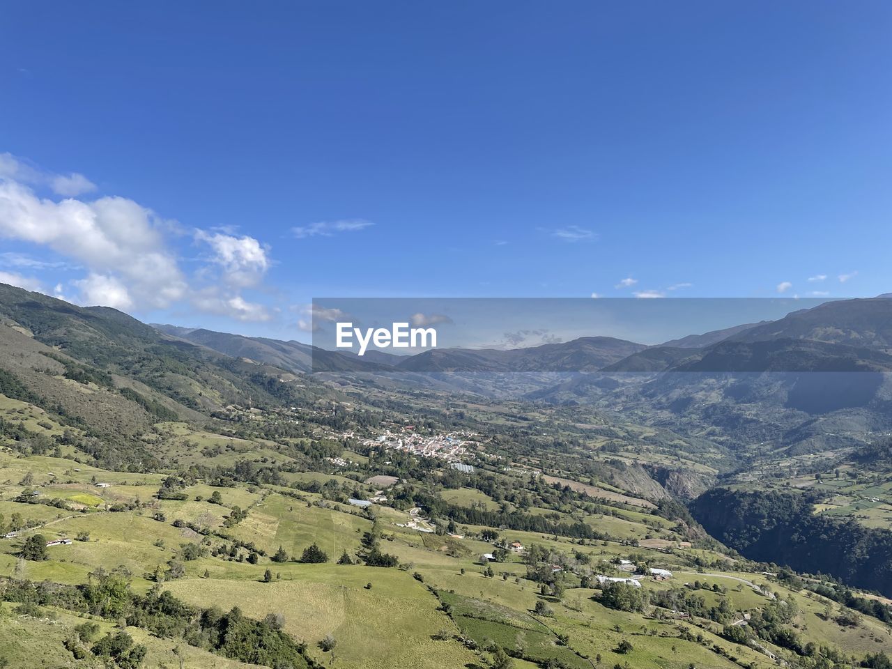 environment, landscape, scenics - nature, mountain, sky, beauty in nature, land, mountain range, nature, tranquility, tranquil scene, cloud, no people, blue, plant, rural scene, non-urban scene, valley, plateau, travel, travel destinations, tree, outdoors, ridge, day, idyllic, field, tourism, agriculture, sunlight, green, forest, remote, grass, high angle view, social issues, summer