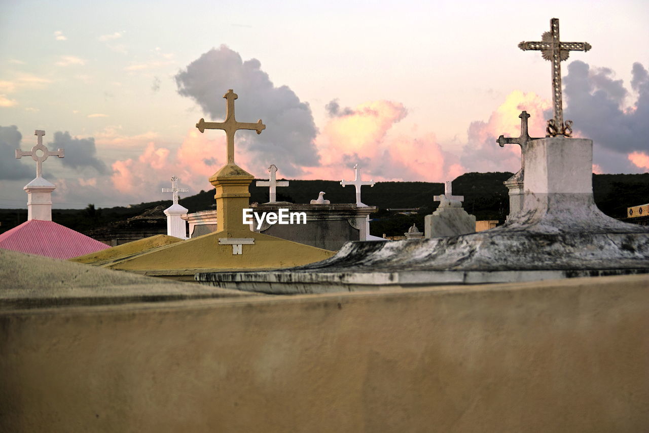 Crosses in cemetery at sunset