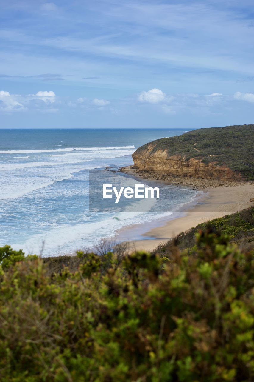 SCENIC VIEW OF SEA AND SHORE AGAINST SKY